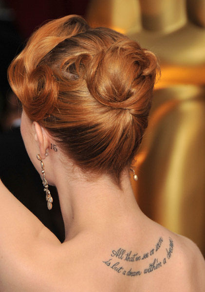 Evan Rachel Wood, sporting a 15 tattoo behind her left ear, not quoted as 