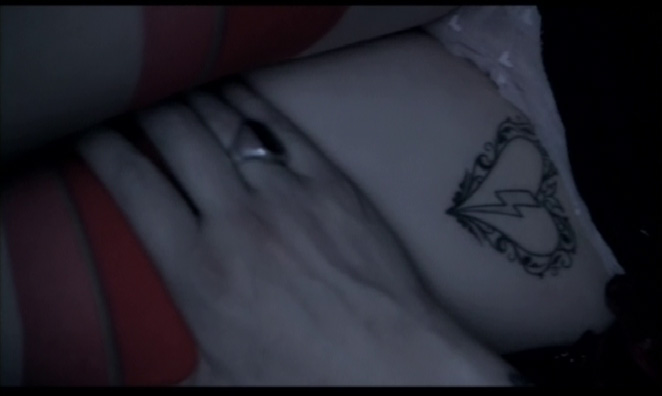Death's Caress ; Still frame from the 'Heart Shaped Glasses' video in April 